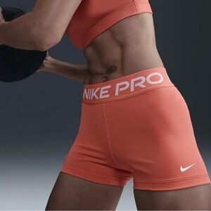 Nike ProWomen's 3" Shorts in wild mango